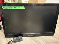 Front view of Lloyds flat-panel television with green tape dimension label visible