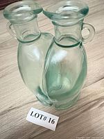 Two glass maple syrup bottles standing together
