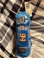 Top view of blue plush race car showing embroidered 94 and moon graphic