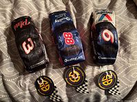 All three plush NASCAR cars with medallions visible