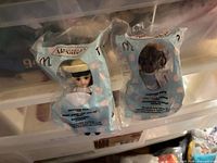Both sealed dolls inside original polybags
