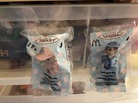 Front view of both sealed Madame Alexander McDonald's toy bags