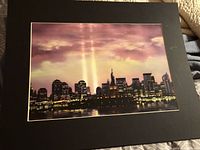Front view of matted photographic print showing city skyline and Statue of Liberty