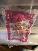Front view of sealed Barbie Happy Meal bag showing figure and branding