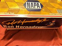 Side panel of box with Ron Hornaday signature and branding