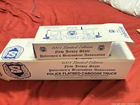 Outer commemorative box showing product name and association details