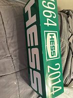 Outer side panel of green anniversary box marked 1964-2014 Hess