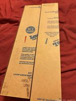 Two long narrow acrylic sheets with protective film and ICI Lucite branding