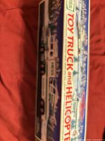 Factory box side panel displaying Hess Toy Truck and Helicopter graphics