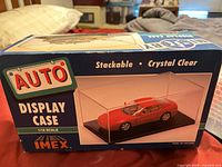Front of IMEX Auto Display Case box showing scale and product image