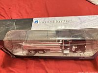 Boxed LongHauler Kenworth W900 diecast truck front angled view