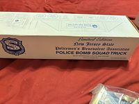 Cream box labeled Limited Edition New Jersey State Police Bomb Squad Truck