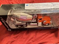 Front angled view of boxed Kenworth cement mixer model