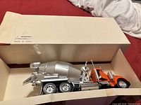 Model truck in open box, side view