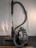 Full view of Dyson DC23 canister vacuum with hose, wand and motorhead