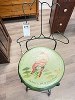 Full view of tall stool showing metal frame, backrest and painted seat