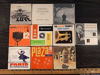 Front view of nine boxed reel-to-reel tapes
