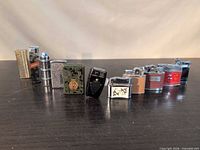 Front view of all 11 assorted vintage lighters in a row