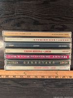 Stack of seven Heart CD jewel cases showing album spines