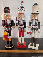 All three wooden nutcrackers standing side by side