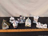 All seven ornaments lined beside ruler