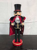 Front view of Victorian pirate nutcracker showing attire and accessories