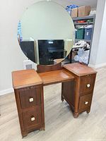 Front view of vanity showing veneer finish, drawers, mirror