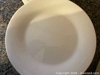 Single white porcelain dinner plate