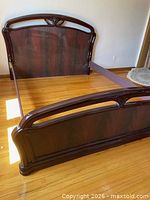 Queen bed frame showing headboard, footboard and side rails