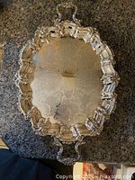 Top view showing full tray with ornate rim and handles