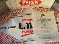Guarantee paperwork inside dish showing Pyrex branding