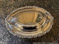 covered serving dish with lid on matching platter