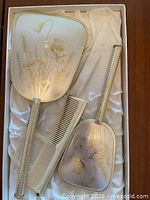 Entire vanity set in box showing mirror, hair brush, comb, clothes brush