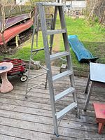 full view of aluminum A-frame ladder on deck