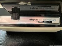 Close-up of Argus 693 Electromatic control panel and logo