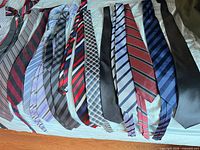 Full assortment of ties laid flat showing patterns and colors