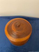 canister with lid on, top view showing knob and ring detail