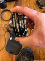 Stack of five filters showing brands, colours and sizes