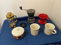 Overview of entire lot showing French press, grinder, dripper, sugar bowl, two mugs