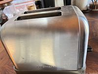 Front angled view showing stainless body and dual slots