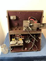 Open case showing editing viewer, splicer, reels and interior