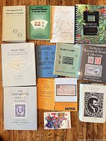 Entire group of books laid out on wood floor