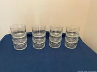 Front view of all 12 stacked tumblers arranged in four columns