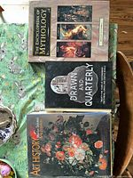 Front covers of all three oversized hardcover books