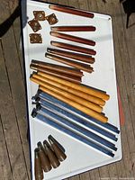 All five sets of table legs and mounting plates laid out on tray