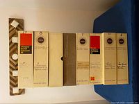 Front view of all eight Kodak Carousel 80 slide trays stacked vertically