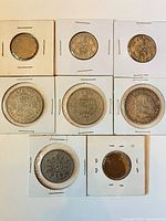 Front view of all nine coins in flips (reverses visible)