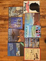 All nine books laid out on floor