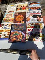 Overhead view showing ten cookbook covers laid out on table