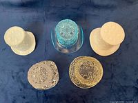 Five Fenton top hats inverted to show bases and color range